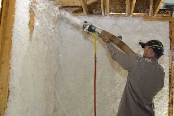 Man doing interior spray foam insulation